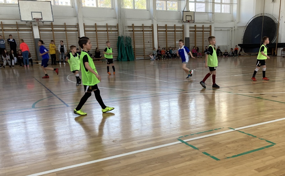 The Ukrainian kids playing Soccer in the school gym.  